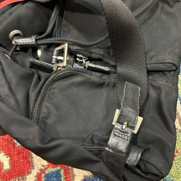 Prada nylon backpack authentic in good condition. Tears on the front straps. main image 9